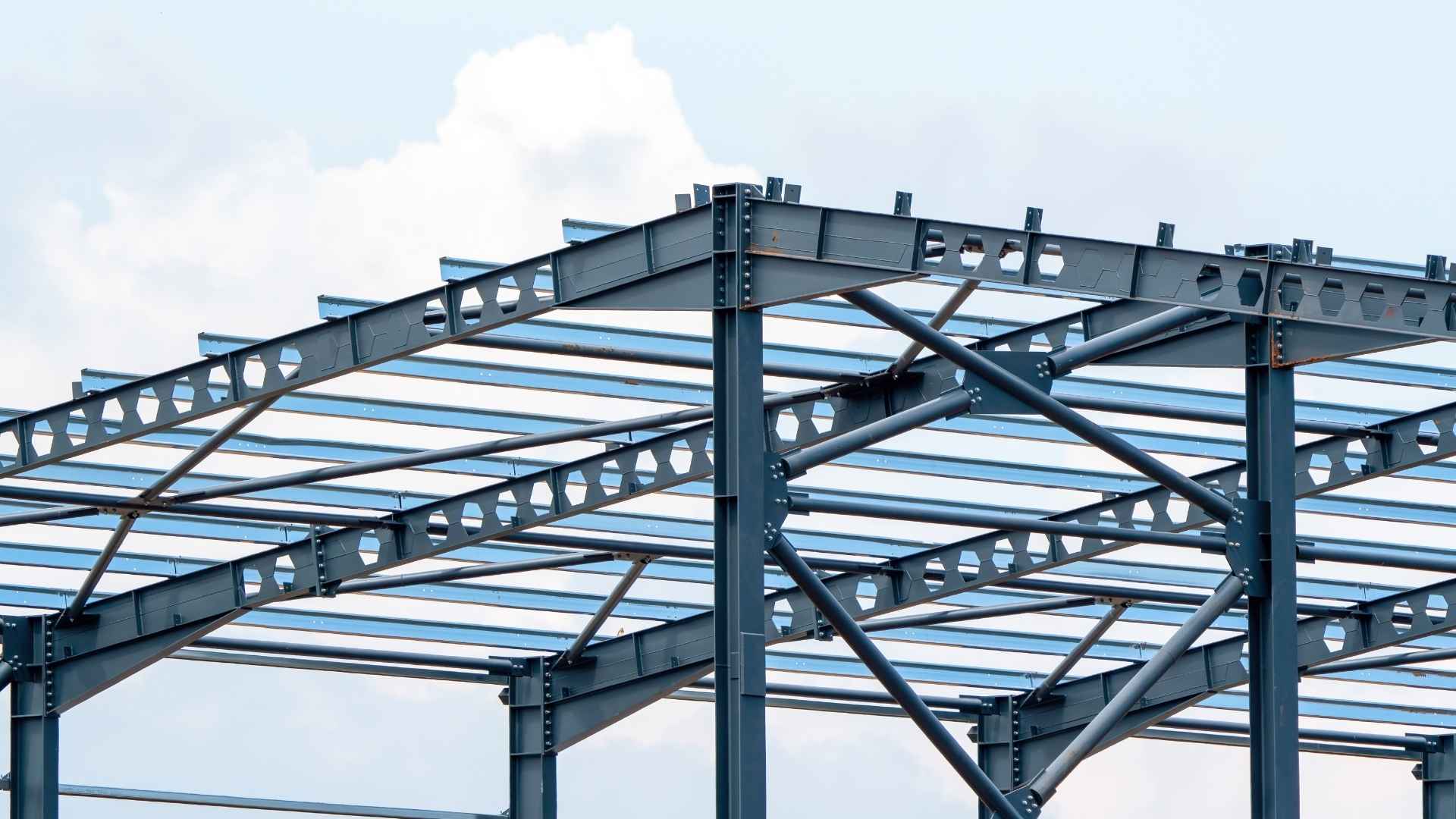 a steel roof structure on a construction site